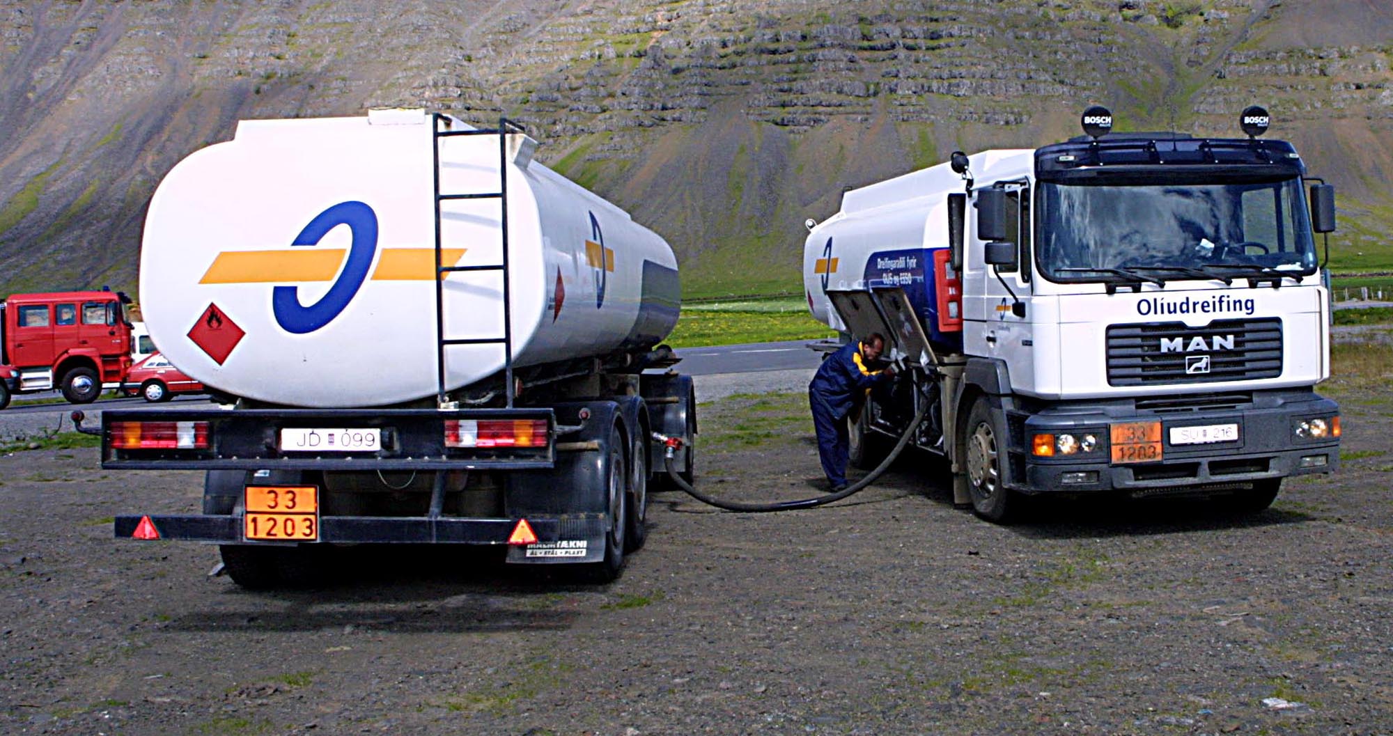 A picture containing text, truck, outdoor, concrete mixer
Description automatically generated